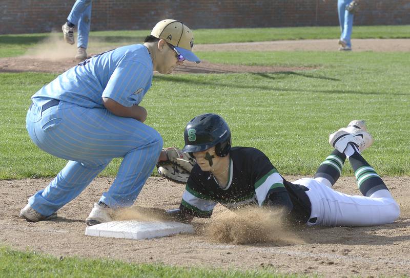 Seneca’s Paxton Giertz gets back into 1st base safely ahead of the tag by Marquette’s Sam Mitre on a pickoff attempt Tuesday at Marquette.