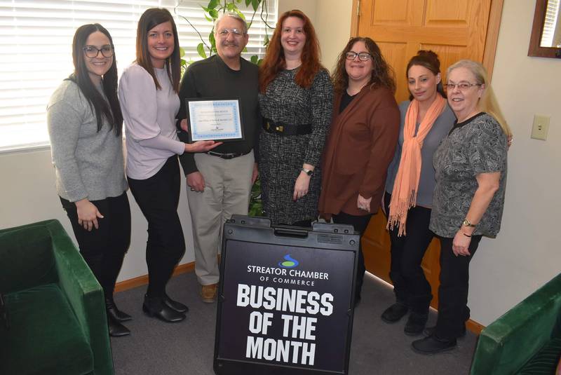 Taking part in awarding the Law Offices of Reilly and Skerston as the Streator Area Chamber of Commerce's January 2023 business of the month, (left to right) are Theresa Solon-Wargo (YoPro board and State Farm), Courtney Levy (chamber executive director), Jim Reilly (owner), Jennifer Skerston (owner), Amy Bersano (employee), Ashley Pohlman (employee) and Kris Conarro (employee). Not pictured is Megan Wright (membership services coordinator for the chamber).