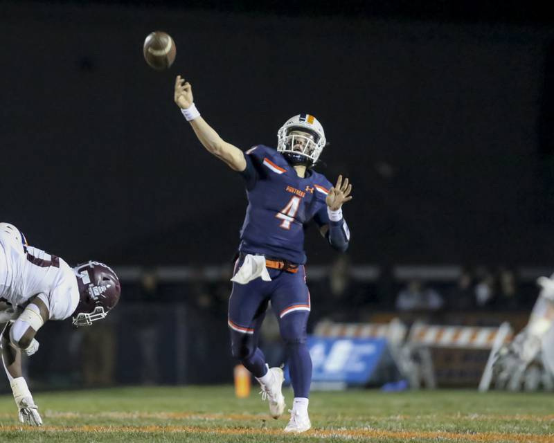 Oswego's Drew Kleinhans (4) unleashes a pass during Class 8A semifinal football game between Lockport at Oswego. Saturday, Nov 22, 2025 in Oswego.