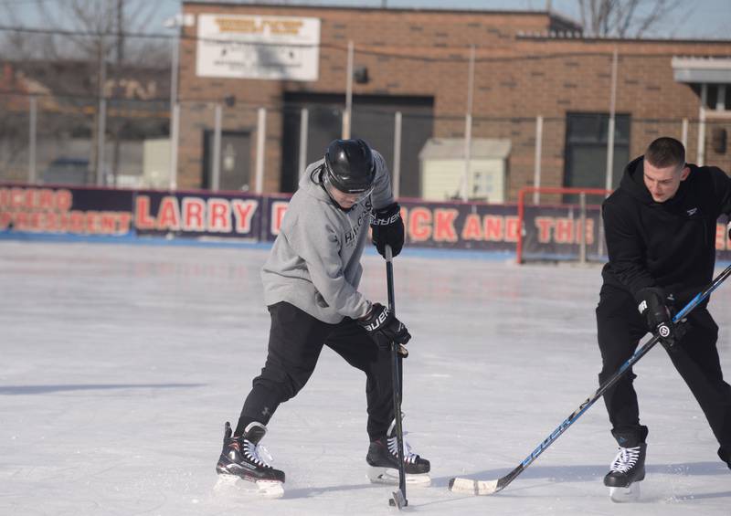 People including Zach Johnson of Chicago and Mark Kulach of Burbank participate in Stick & Puck at the Bobby Hull Community Ice Rink Sunday, Jan. 26, 2025 in Cicero.