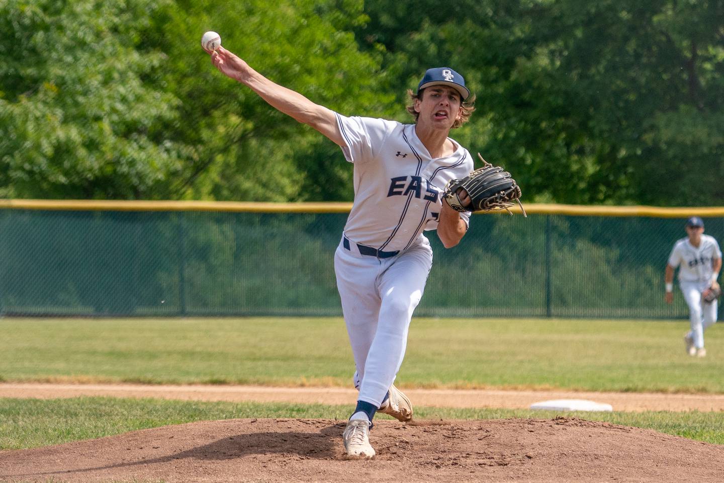 Oswego East's Griffin Sleyko (21) delivers a pitch against Waubonsie Valley during the Class 4A Waubonsie Valley Regional final between Waubonsie Valley and Oswego Easy at Waubonsie Valley High School in Aurora on Saturday, May 27, 2023.