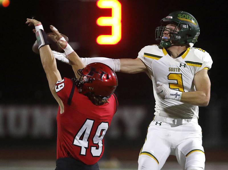 Huntley's Ari Fiebig breaks up a pass intended for Crystal Lake South's Colton Hess during a Fox Valley Conference football game on Friday, Sept. 29, 2023, at Huntley High School.
