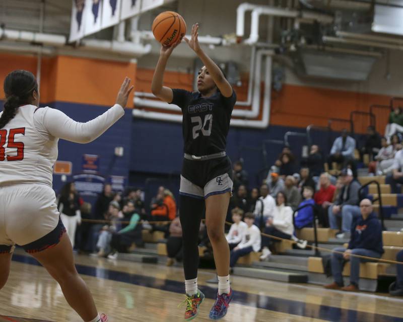 Oswego East's Ja'liyah Shepart (20) shoots a three during their basketball game between Oswego East at Oswego Friday, Jan 09, 2026 in Oswego.