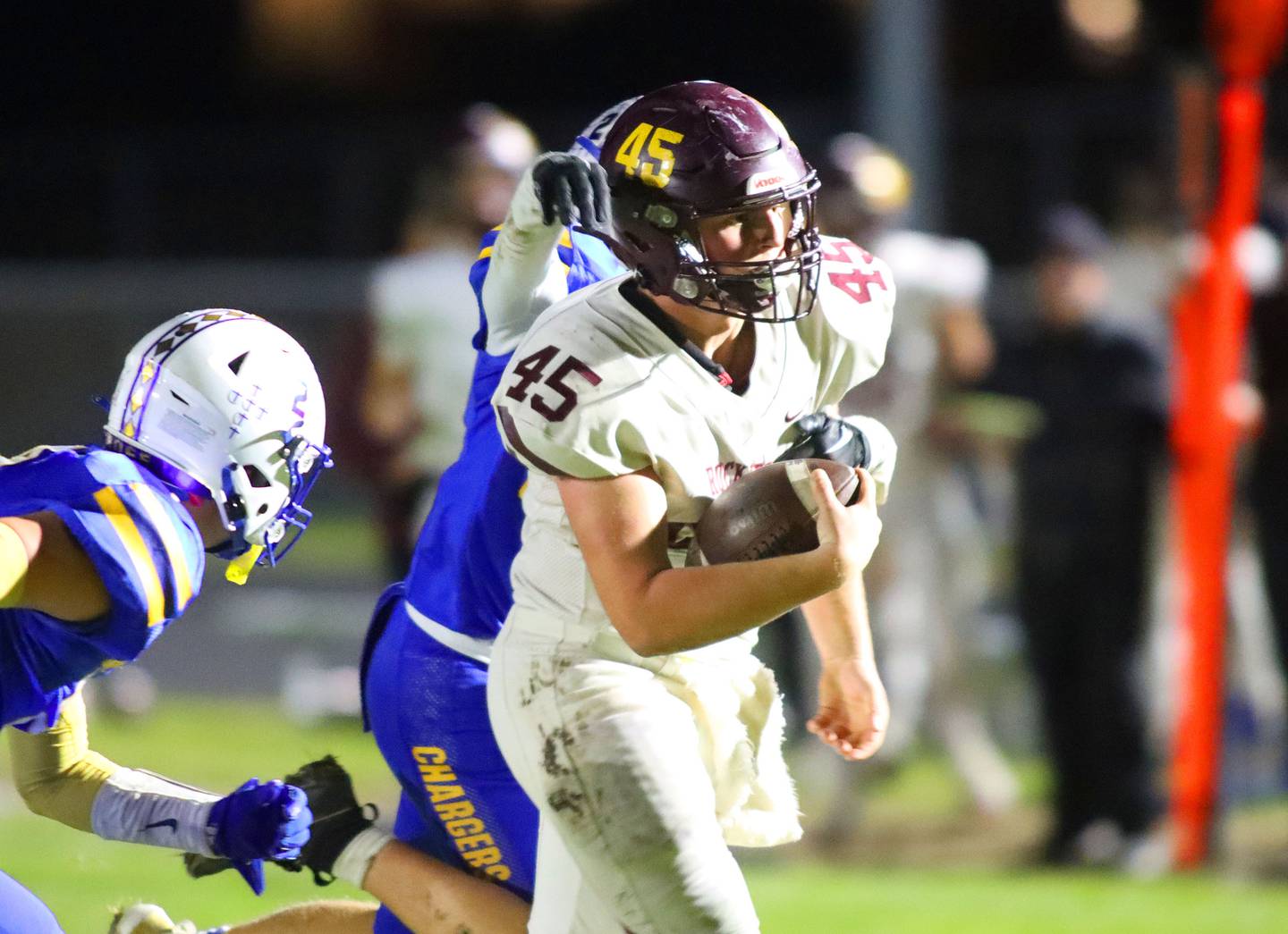 Richmond-Burton’s Riley Shea navigates Charger traffic in IHSA football Class 3A second-round playoff action at Bob Stewart Field on the campus of Aurora Central Catholic High School in Aurora on Friday, November 7, 2025.