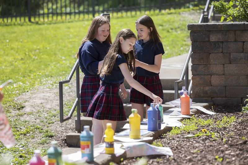 Dixon St. Mary’s students lay out their bubble art projects Friday, May 9, 2025.
