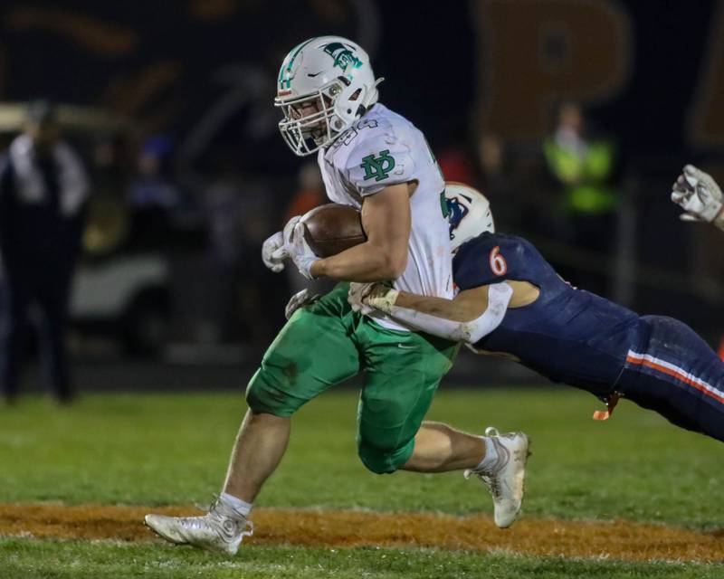 York's Jimmy Connors (34) runs with the ball during Class 8A second- round football game between York at Oswego on Friday, Nov 8, 2024  in Oswego.