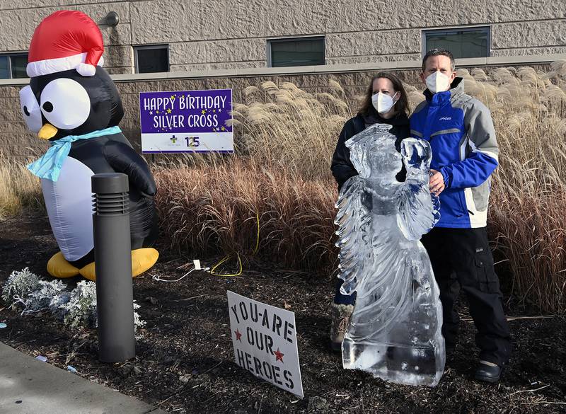 Chef Michael McGreal, head of the culinary arts department at Joliet Junior College with his wife Kristy sets up a 400 pound ice angel at the employee entrances at Silver Cross on Monday, December, 21, 2020, at Silver Cross Hospital,New Lenox, III.