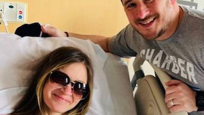 D-C wrestling coach Tim Hayes and wife Katie deliver their son in a car