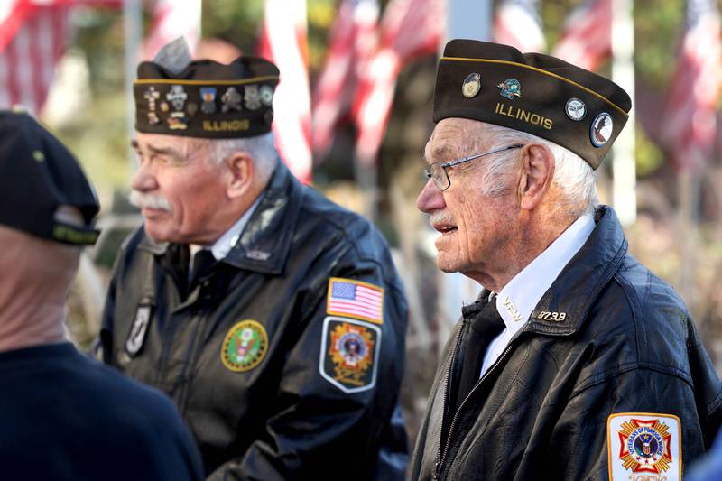 US Army Veterans John Tuttle (left) and Stan Eden listen to speakers Friday, Nov. 8, 2024, during the opening of the 24-Hour Veterans Vigil at the DeKalb County Courthouse in Sycamore.
