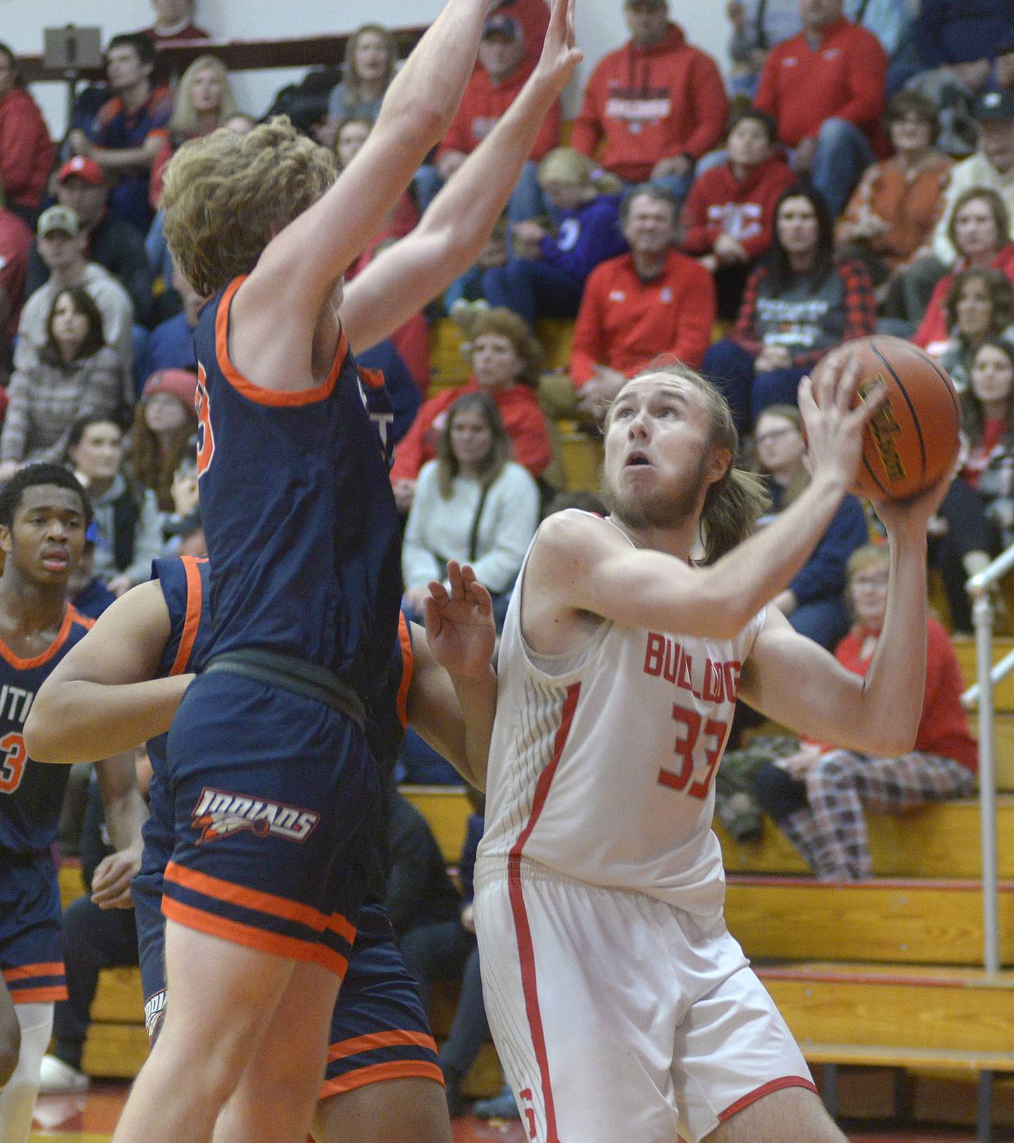 Pontiac’s Conrad Pfaff jumps to block the shot by Streator’s Quinn Baker in the second period Saturday at Streator.