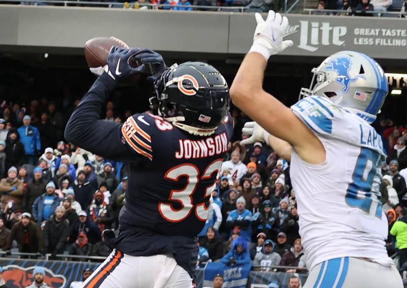 Chicago Bears cornerback Jaylon Johnson intercepts a pass intended for Detroit Lions tight end Sam LaPorta during their game Sunday, Dec. 10, 2023 at Soldier Field in Chicago.