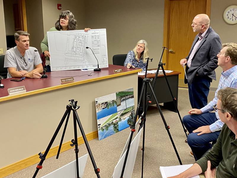 Third Ward Alderperson Nancy Copple (second from left) confers with fellow Sycamore Planning and Zoning Commission members about a proposal for a distillery, restaurant and event space by Sycamore businessman Chris Mayer while holding a site plan from Epstein Global architecture firm Monday, Oct. 9, 2023 at the Sycamore City Center, 308 W. State St.