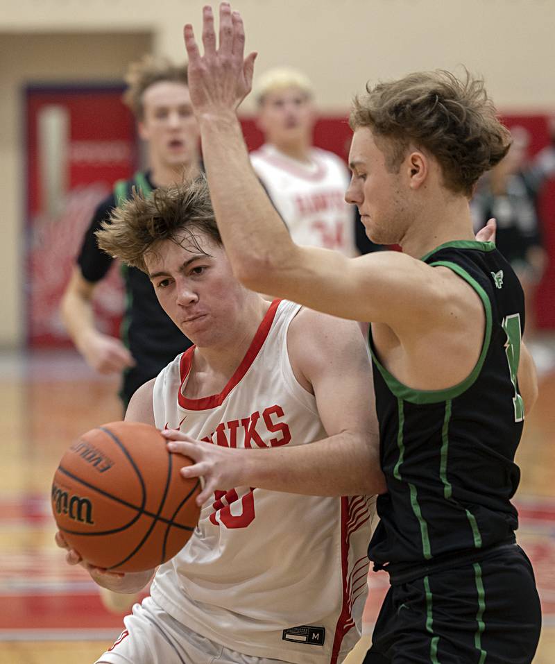 Oregon’s Keaton Salsbury works against Rock Falls’ Kuitim Heald Tuesday, Dec. 12, 2023 in Oregon.