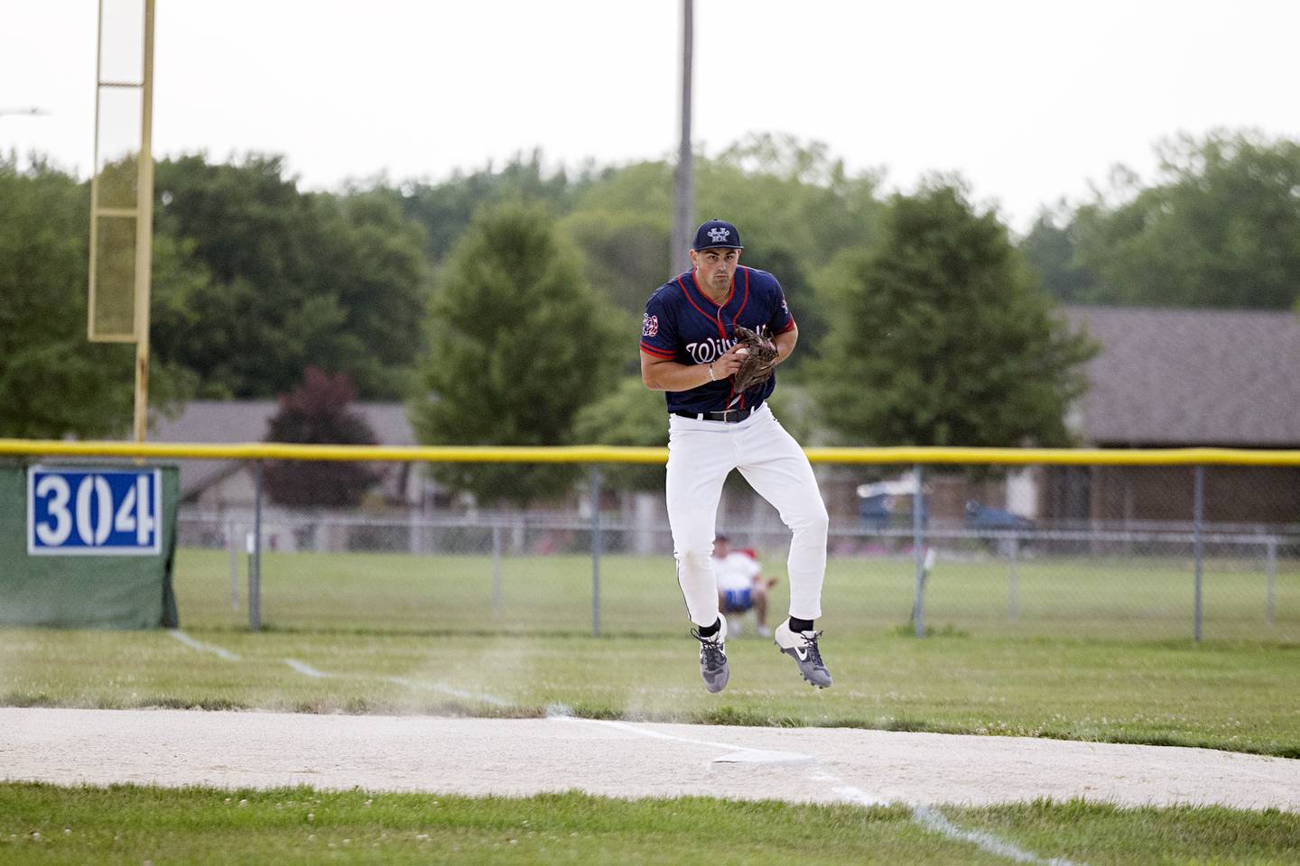 Tyler Willman of the Whiteside Wildcats semi-pro team fields a ball at first against Palmer Wednesday, July 19, 2023.