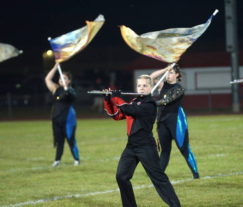 Oregon High School marching band member Madeline Rogers plays the flute during halftime of the football game with Rock Falls on Friday, Sept. 19, 2025.