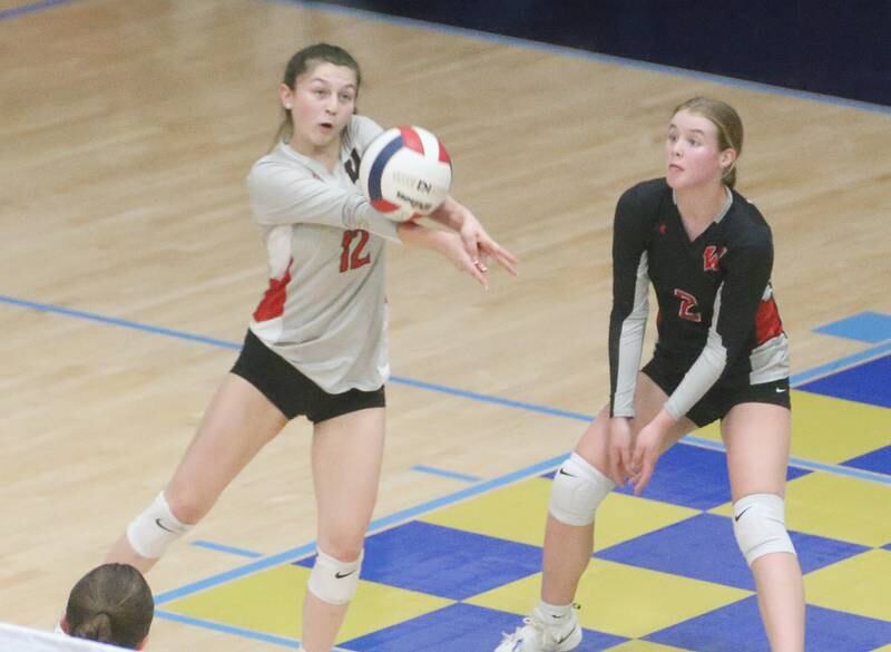 Woodland's libero Kaiden Connor returns a serve from Marquette on Thursday, Oct. 19, 2023 at Bader Gym.