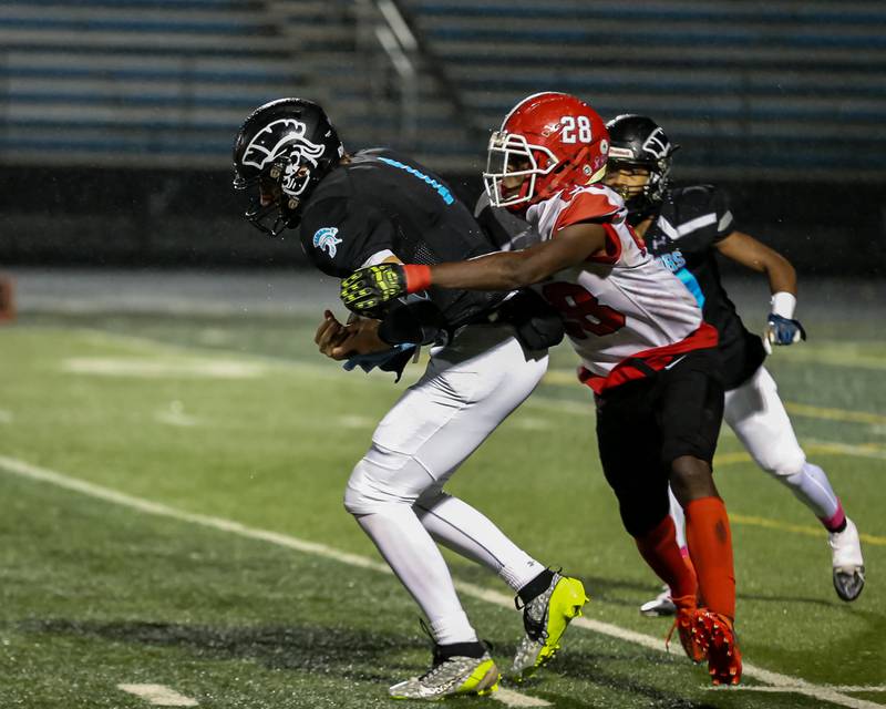 Yorkville's Bryce Griffin (28) sacks Willowbrook's Arthur Palicki (1) during Class 7A football playoff game between Yorkville at Willowbrook.   Oct 27, 2023.
