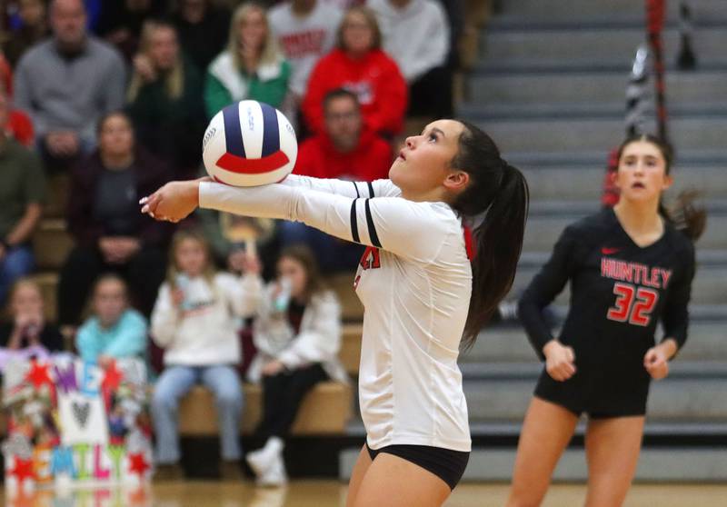 Huntley’s Sophia Tocmo passes the ball against Hampshire in girls varsity volleyball at Huntley High School on Thursday, October 23, 2025.