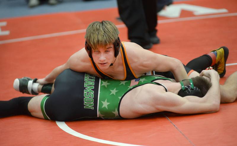 Sandwich’s Jaxson Blanchard holds Rock Falls’ Logan Williamson on the mat as they wrestle at 138 pounds at the 1A Oregon Sectional on Friday, Feb. 14, 2025.