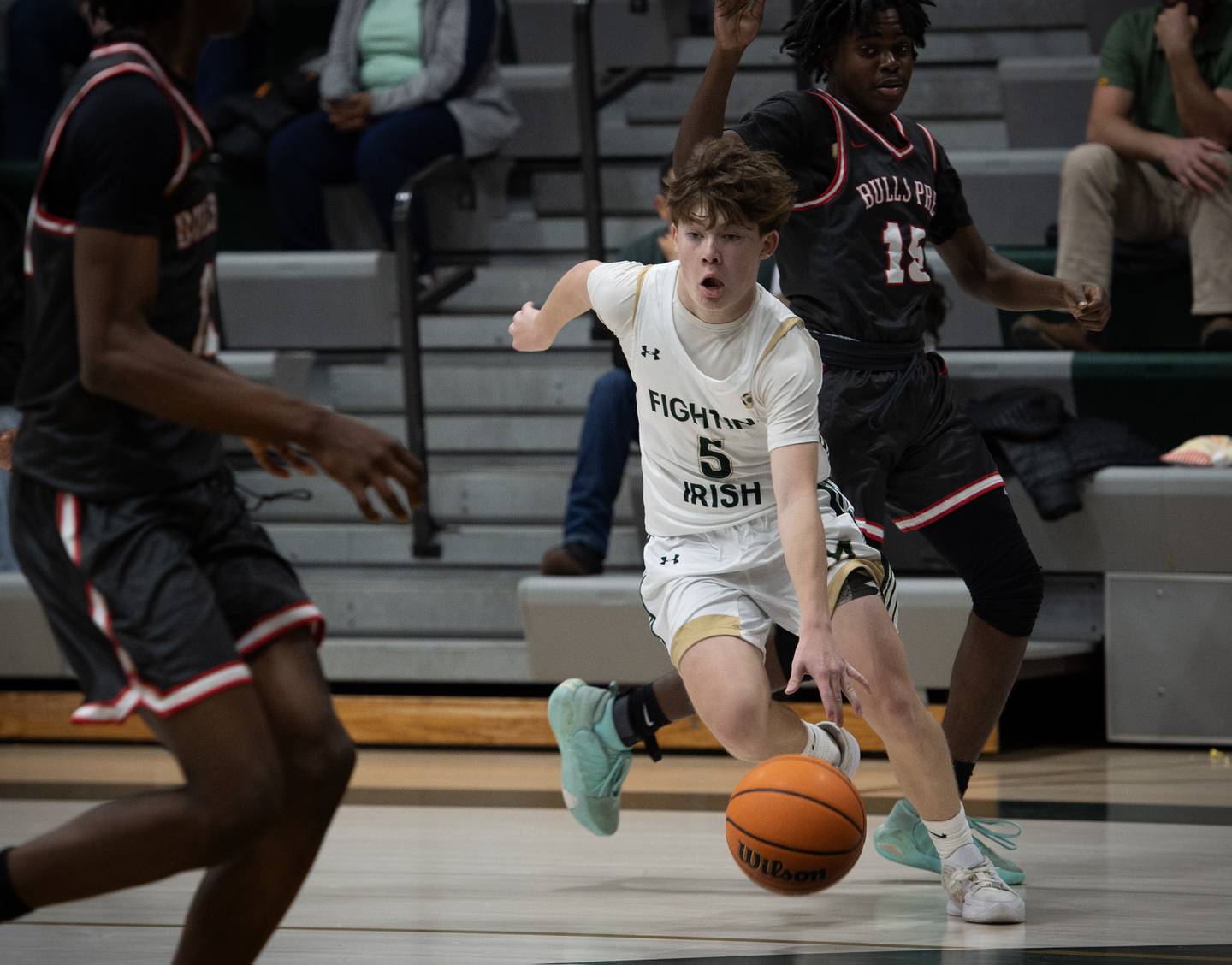 Bishop McNamara's Jayson Benton moves the ball past Chicago Bulls Prep's Elijah Andre Frankle, right, in a game on Friday, Decemeber 19, 2025.