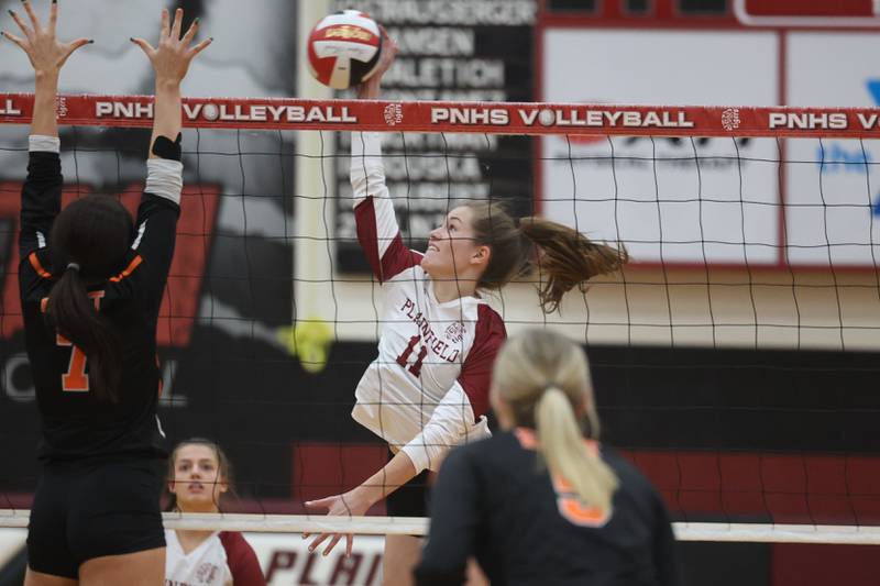 Plainfield North’s Lauren Jansen goes for the kill against Plainfield East on Thursday night.