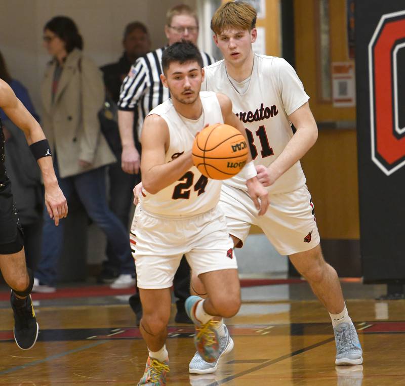 Forreston's Mickey Probst (24)  heads up the court as Brennan Byers (31) follows during a play against Pecatonica at Forreston High School on Wednesday, Feb. 11, 2026.