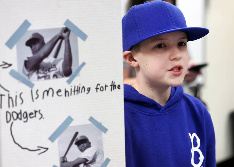 Liam Larkin, a fifth grade student at Malta Elementary School, portrays Jackie Robinson Monday, March 4, 2024, during the schools Wax Museum. In honor of Black History Month students in fifth grade at the school research a Black historical figure and do a presentation on their person at the end of the month.