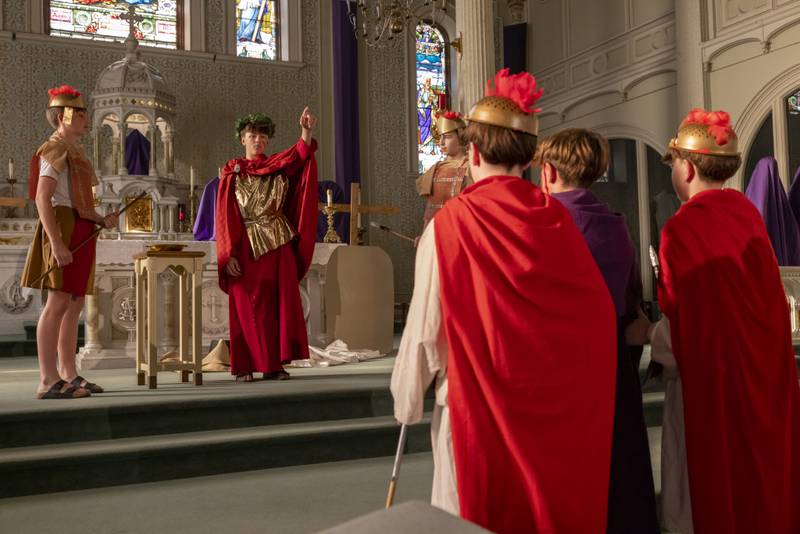 Anthony Turri, portraying Pontius Pilate gives Jesus over to the crowd after washing his hands clean during the Stations of The Cross event on April 16, 2025 at St. Patrick's Church.