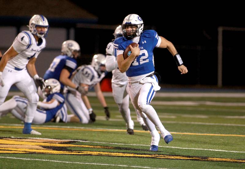 Geneva quarterback Tony Chahino runs the ball on Friday, Oct. 25, 2024 during a game against St. Charles North at Geneva.