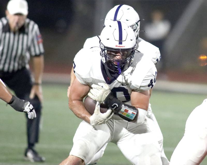 Cary-Grove’s Logan Abrams runs the ball in varsity football at Huntley High School in Huntley on Friday, Sept. 19, 2025.