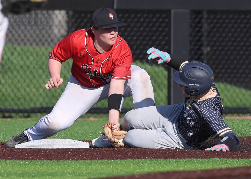 Hiawatha's Keegan Marshall is out trying to steal third as South Beloit's Jaycee Schober applies the tag Thursday, April 16, 2026, during their game at Northern Illinois University in DeKalb.