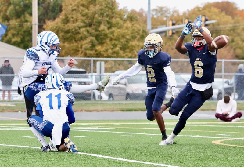 Bloomington Central Catholic's Valshun Powe blocks a PAT kick by Princeton's Braylon Clevenger in Saturday's 3A playoff opener in Bloomington.