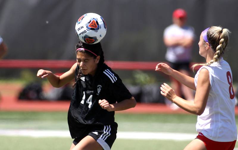 Fenwick’s Kiera Mullarkey (14) heads the ball during an IHSA Class 2A state semifinal game against Triad at North Central College in Naperville on Friday, June 3, 2022.