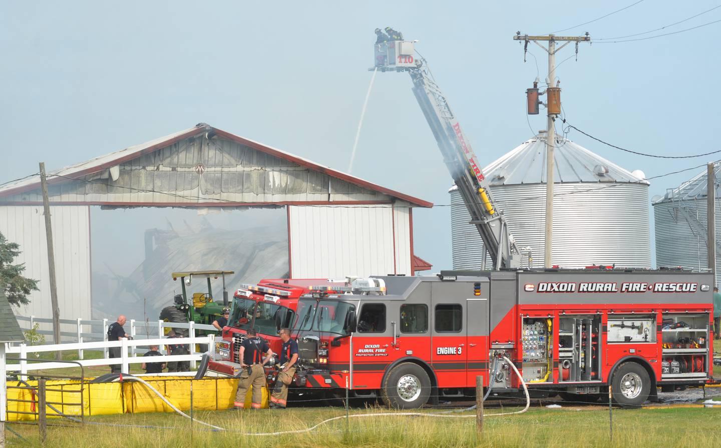 Firefighters from several departments were called to the scene of a shed fire at the intersection of Illinois Route 2 and Lost Nation Road, north of Dixon on Friday morning. Farm machinery and 120-150 round bales of hay were destroyed in the fire which was reported at 6:39 a.m. There were no injuries to residents or livestock.