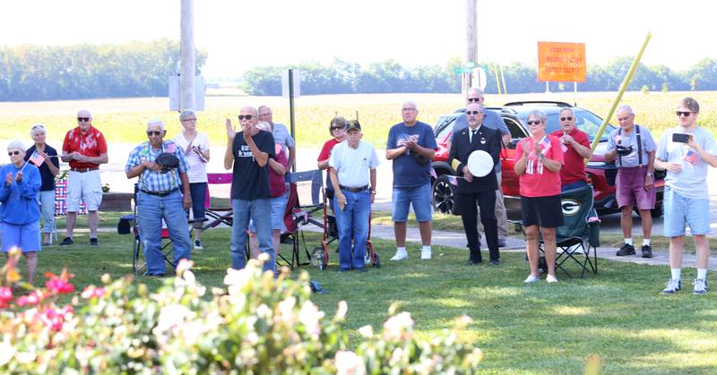 A crowd of people gather during a 9/11 memorial ceremony on Thursday, Sept. 11, 2025 at the Veterans Park in Ladd.