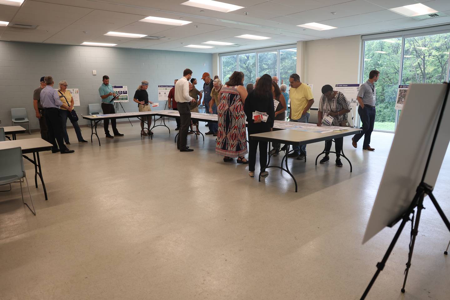People attend an open house on the Mill-Cherry Hill Road Study at the Nowell Park Recreation Center in Joliet on Tuesday, July 30, 2024.
