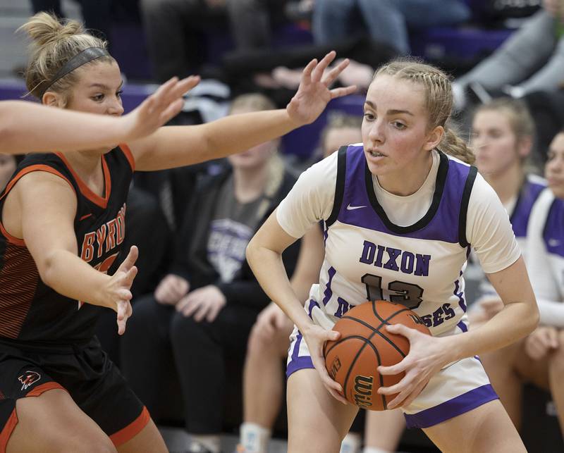 Dixon’s Kait Knipple handles the ball late in the game against Byron Tuesday, Jan. 24, 2023.