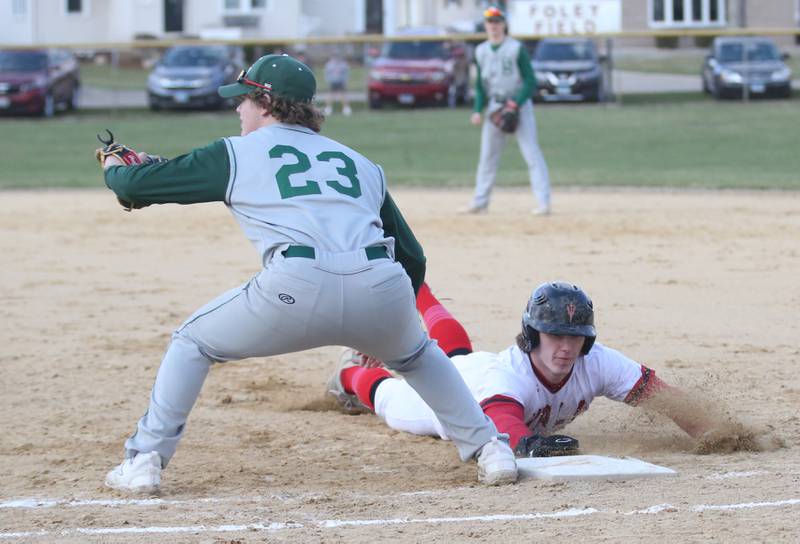 Hall's Mac Resetich slides back into first base as St. Bede's Luke Tunnel waits for a late throw on Monday, March 27, 2023 at Kirby Park in Spring Valley.