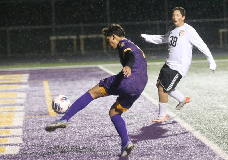 Mendota's Isaac Diaz kicks the ball ahead of Kewanee's Ivan Ruiz to the keeper during the Class 1A Regional game on Wednesday Oct. 18, 2023 at Mendota High School.