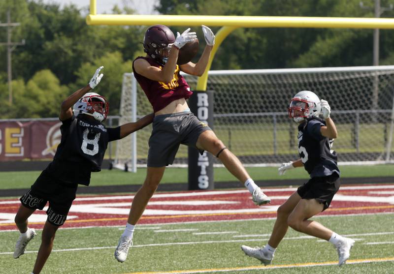 Richmond-Burton's Jace Nelson catches a pass during a 7 on 7 football practice Monday, July 14, 2025, at Richmond-Burton High School, with teams from Crystal Lake Central, Grayslake Central and Mundelein.