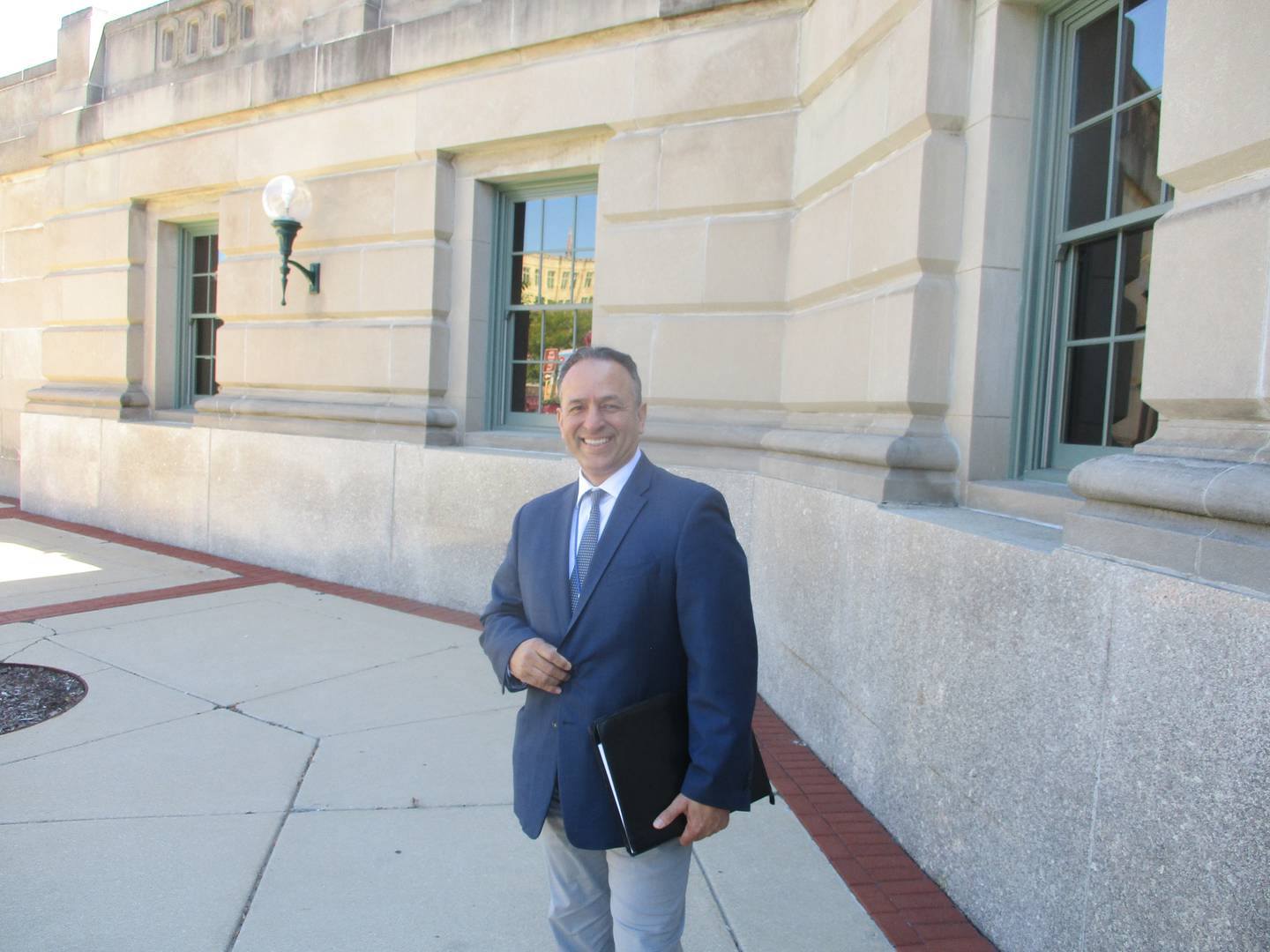 Joliet Economic Development Director Cesar Suarez stands outside the MyGrain Brewery space that the city is trying to fill on Aug. 31, 2023.