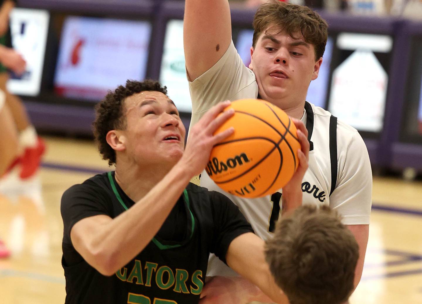 Crystal Lake South's Cooper Buelna goes up against Sycamore's Michael Chami during their sectional semifinal game Tuesday, March 4, 2025, at Rochelle High School.