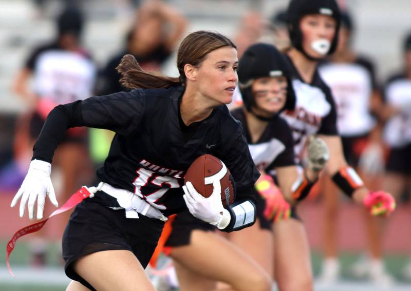 Huntley’s Aubrina Adamik cruises toward the end zone with a touchdown against McHenry in varsity flag football at Huntley High School in Huntley on Tuesday, Sept. 9, 2025.
