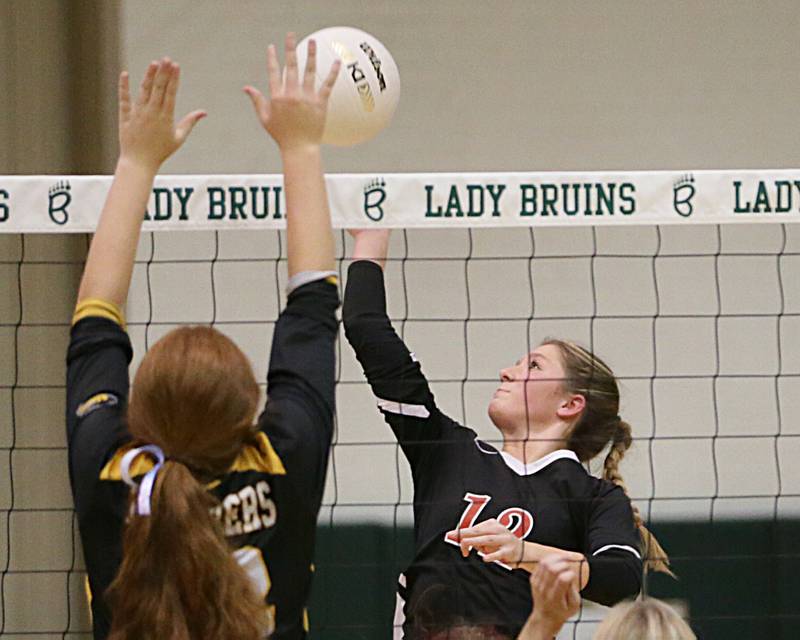 Earlville's Hannah Plaff (12) spike is blocked by Putnam County's Maggie Spratt (32) in the Class 1A Regional game on Monday, Oct. 24, 2022 at St. Bede Academy in Peru.