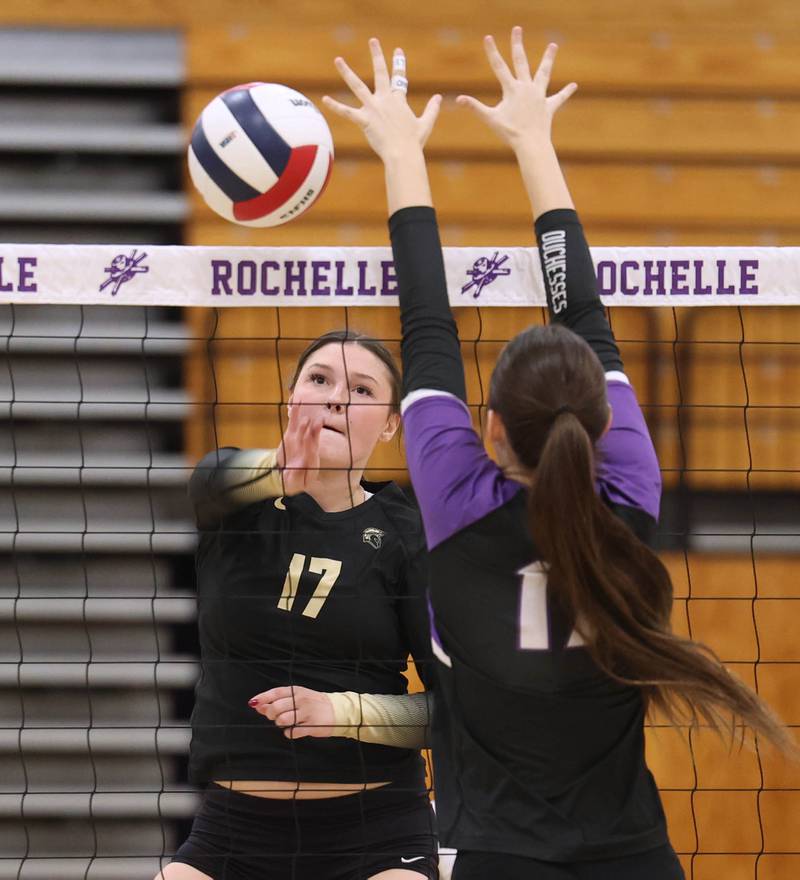 Sycamore's Laney Block spikes the ball by Dixon’s Lucy Feick Thursday, Oct. 30, 2025, during their Class 3A regional championship match in Rochelle.