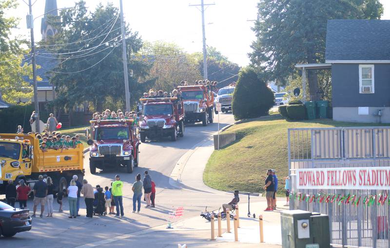 Members of the L-P football team ride past Howard Fellows Stadium during the L-P Homecoming parade on Thursday, Sept. 26, 2024 in Peru.