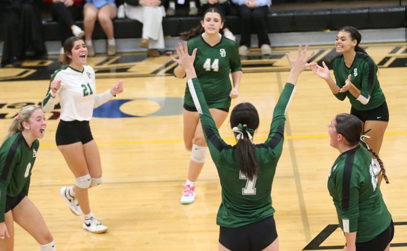 Members of the St. Bede volleyball team react after winning the first set against Orion during the Class 1A Regional semifinals on Wednesday, Oct. 29, 2025 at Putnam County High School.