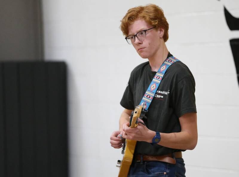 Putnam County High School student Jackson Del Hotal plays the National Anthem on his electric guitar during the football Homecoming Pep Rally on Friday, Sept. 27, 2024 at Putnam County High School in Granville.