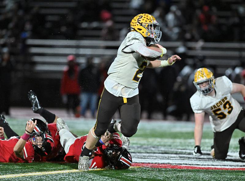 Jacob's Ryan Tucker breaks a tackle during the class 7A first round  playoff game against Lincoln-Way Central on Friday, Oct. 27, 2023, at New Lenox. (Dean Reid for Shaw Local News Network)