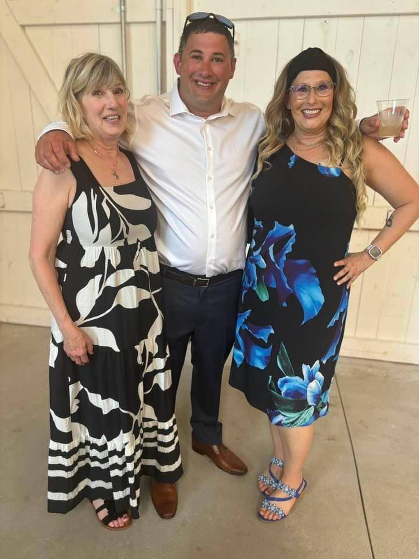 Shannon Connolly, right, poses for a photo with her brother Kevin Connolly and her mother Sharon Connolly.